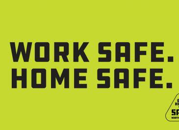 Green background with black Work Safe Home Safe