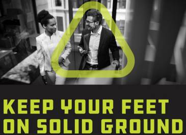 Man and woman walking in office building