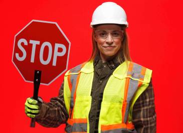 Woman holding stop sign