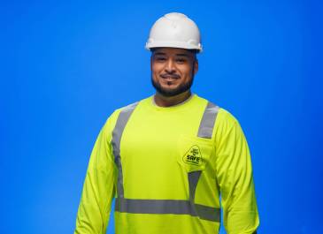 Man wearing hi-vis shirt and hard hat