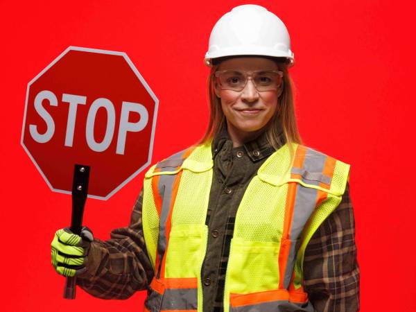 Woman holding stop sign