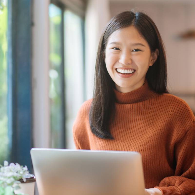 Woman sitting at desk with laptop 