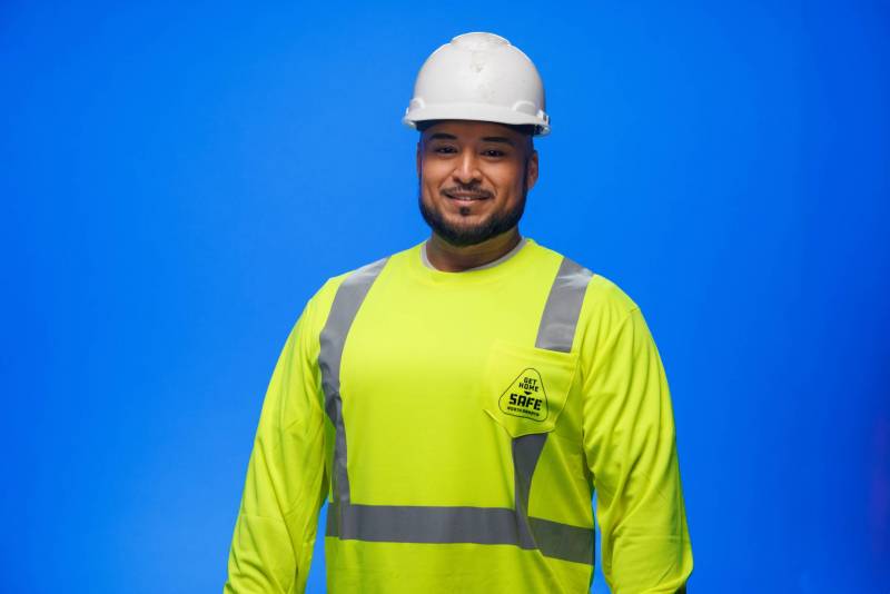Man wearing hi-vis shirt and hard hat